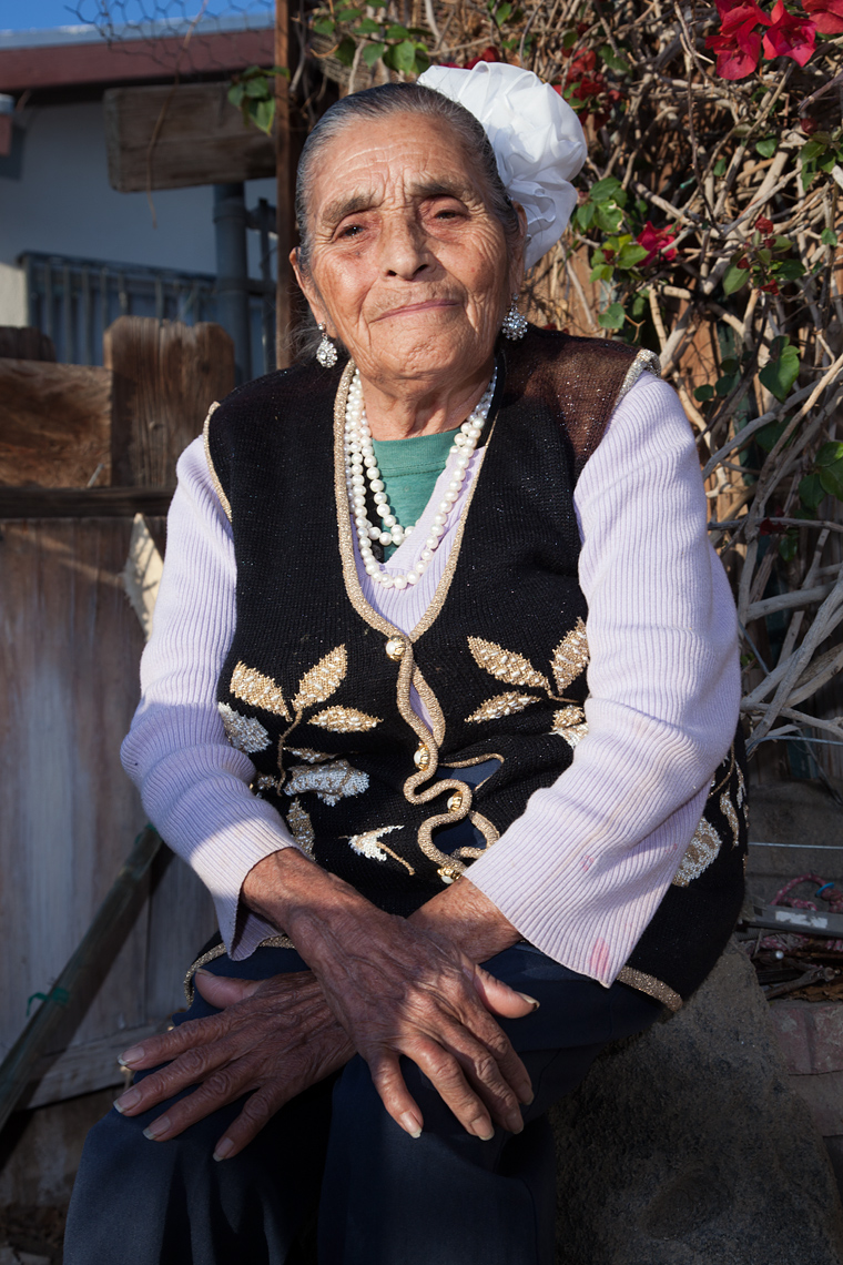 Portrait of Maria Aguirre de Bañuelos outside of her home in Coachella, Ca.